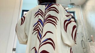 PeachJars takes off her robe in the bathroom