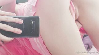 Nymphetty in pink moves her panties to the side